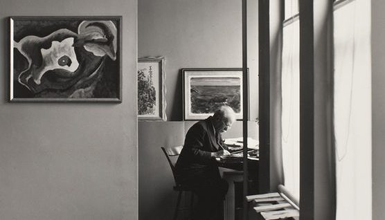 Image of Ansel Adams in his office.