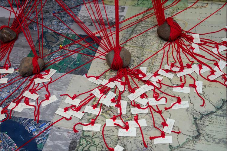 Image of a map with red string