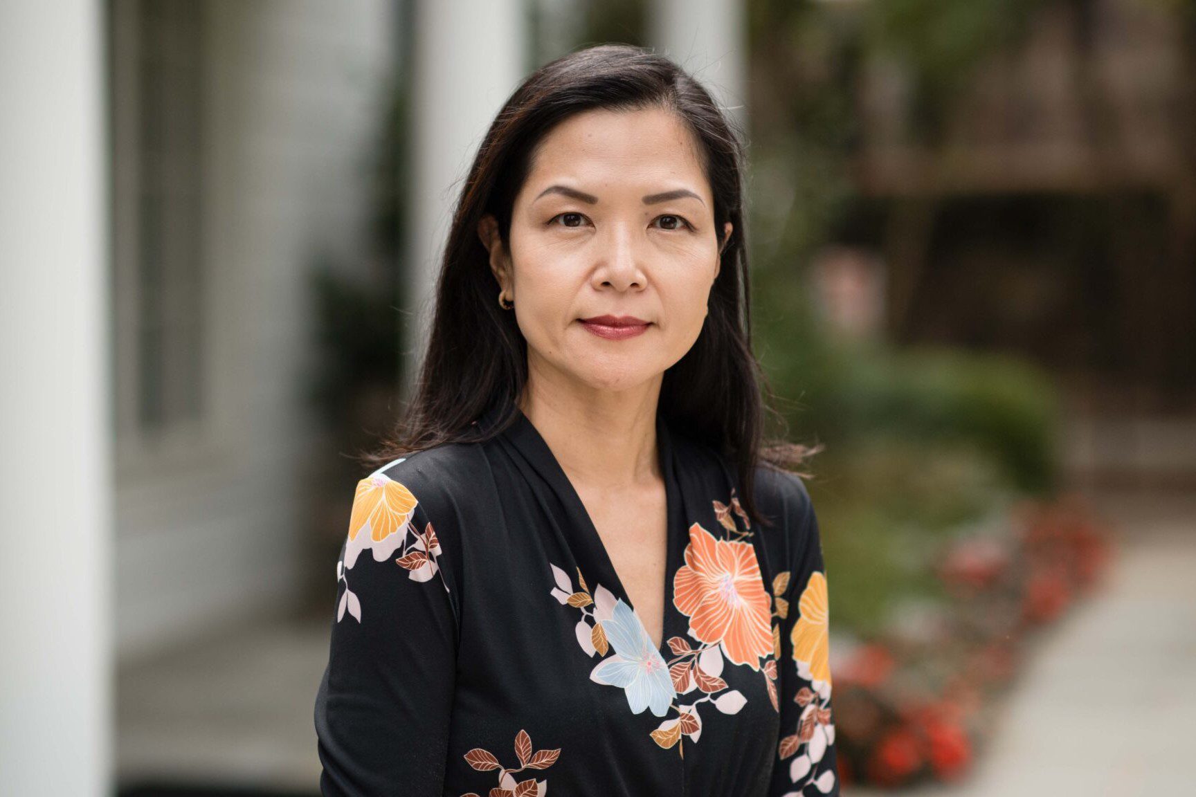 Christina Lee standing near Scheide Caldwell House