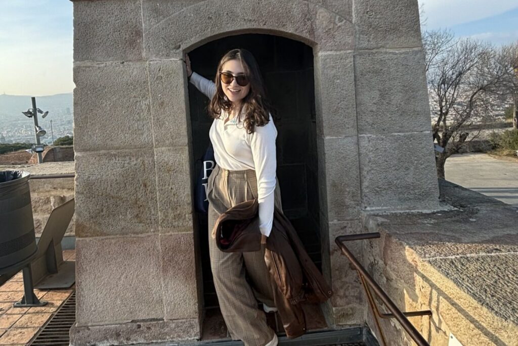 Student in a stone doorway.